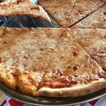 Manny's Pizzeria - Cheese pizza goodness. - Pizza Near Me - Palm Coast, Florida Manny's Pizzeria - Cheese pizza goodness. - Pizza Near Me - Palm Coast, Florida