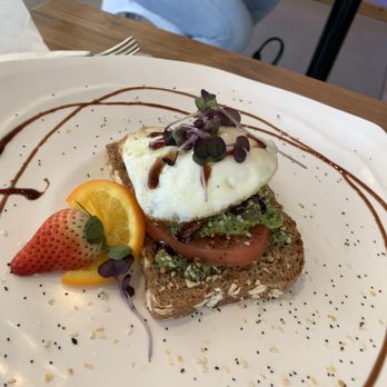 Revelations Cafe - Avocado Toast with an over easy egg on top. - Breakfast & Brunch Near Me - Lutz, Florida Revelations Cafe - Avocado Toast with an over easy egg on top. - Breakfast & Brunch Near Me - Lutz, Florida