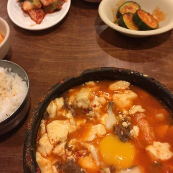 Lighthouse Tofu - Soondubu + raw egg and side dishes in the back - Korean Near Me - Annandale, Virginia Lighthouse Tofu - Soondubu + raw egg and side dishes in the back - Korean Near Me - Annandale, Virginia