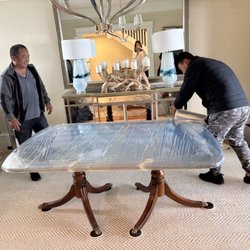 All Star Moving Company - Wrapping up the table.
