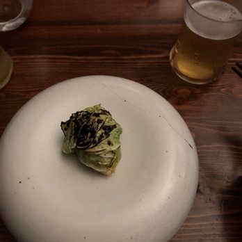 Mixtli - Octopus-filled cabbage roll, paired with a Hawaiian beer at Mixtli - Mexican Near Me - San Antonio, Texas