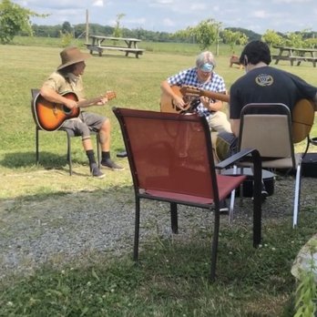 Chateau Dusseau - a group of people playing guitar - Wineries Near Me - Locke, New York