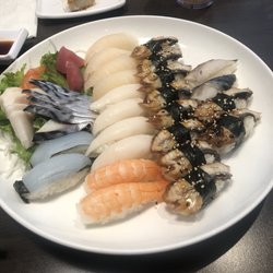 Sushi Village - Various nigiri and mackerel, salmon and, tuna sashimi.