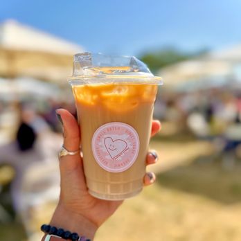 PackPack Coffee - a hand holding a cup of iced coffee - Coffee & Tea Near Me - Costa Mesa, California PackPack Coffee - a hand holding a cup of iced coffee - Coffee & Tea Near Me - Costa Mesa, California