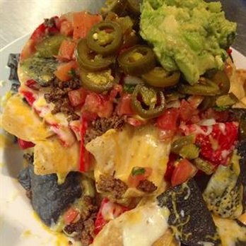 Redmond's Bar & Grill - Full nachos with avocado and cheese. - American Near Me - Redmond, Washington Redmond's Bar & Grill - Full nachos with avocado and cheese. - American Near Me - Redmond, Washington