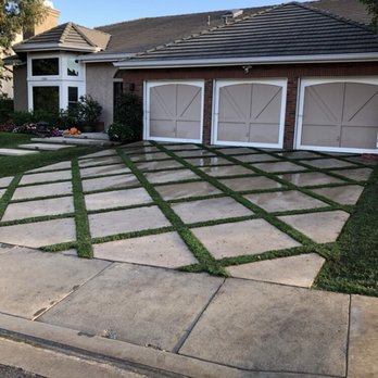 GreenCoast Landscapes - a house with a driveway and lawn - Landscaping Near Me GreenCoast Landscapes - a house with a driveway and lawn - Landscaping Near Me