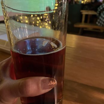 The Cue Club - a person holding a glass of beer - Sports Bars Near Me - Annandale, Virginia The Cue Club - a person holding a glass of beer - Sports Bars Near Me - Annandale, Virginia
