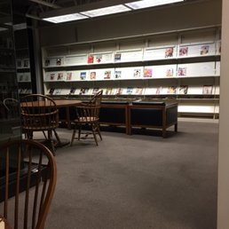 Magazine area with chairs and tables