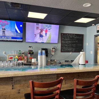 Salty Pint - a bar with two televisions on the wall - Sandwiches Near Me - Daytona Beach Shores, Florida