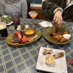 Sheridan's Restaurant and Tavern - Wings  Buffalo chicken dip nachos Arugula and beet salad.
