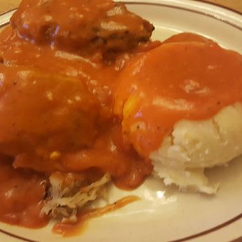 The Red Chimney - 2 cabbage rolls tightly packed and you can cut with a fork! served over kraut and mashed potatoes - Modern European Near Me - Parma, Ohio The Red Chimney - 2 cabbage rolls tightly packed and you can cut with a fork! served over kraut and mashed potatoes - Modern European Near Me - Parma, Ohio