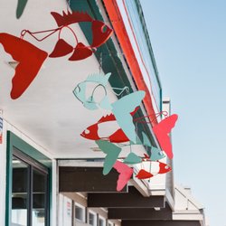 Riva Fish House - Local artist Jeff Owen's beautiful fish dancing in the sea breezes on the Santa Cruz wharf!