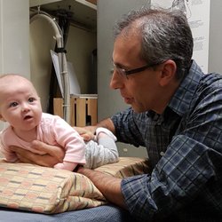 Great Life Chiropractic - Dr Gus checking baby's little spine