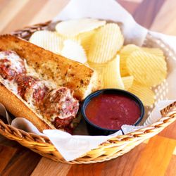 Dion's Pizza - A 6" meatball sub with chips and a side of marinara.