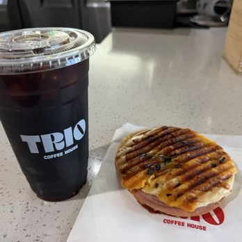Trio Coffee House - Cold Brew and Jalapeño Ham and Cheese Sandwich - Coffee & Tea Near Me - Palmdale, California Trio Coffee House - Cold Brew and Jalapeño Ham and Cheese Sandwich - Coffee & Tea Near Me - Palmdale, California
