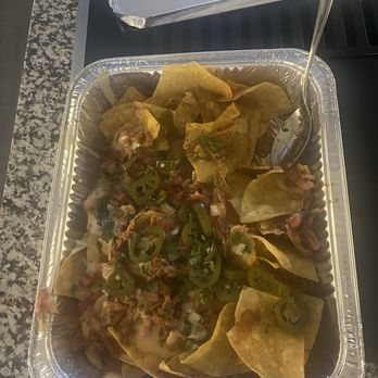 The Smoke Pit - Chicken nachos. Big portion but bottom chips were plain. - Southern Near Me - Salisbury, North Carolina The Smoke Pit - Chicken nachos. Big portion but bottom chips were plain. - Southern Near Me - Salisbury, North Carolina
