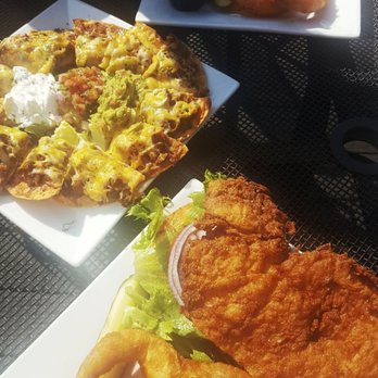 Fire By The Monon - That's ONE tenderloin split in half on two plates! - American Near Me - Indianapolis, Indiana