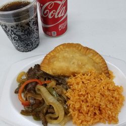 La Raza Deli - Pepper Steak, yellow rice & a beef empanada with a soda on the side