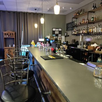 Jackpot Bistro - a bar with stools and shelves - Salad Near Me - Gresham, Oregon