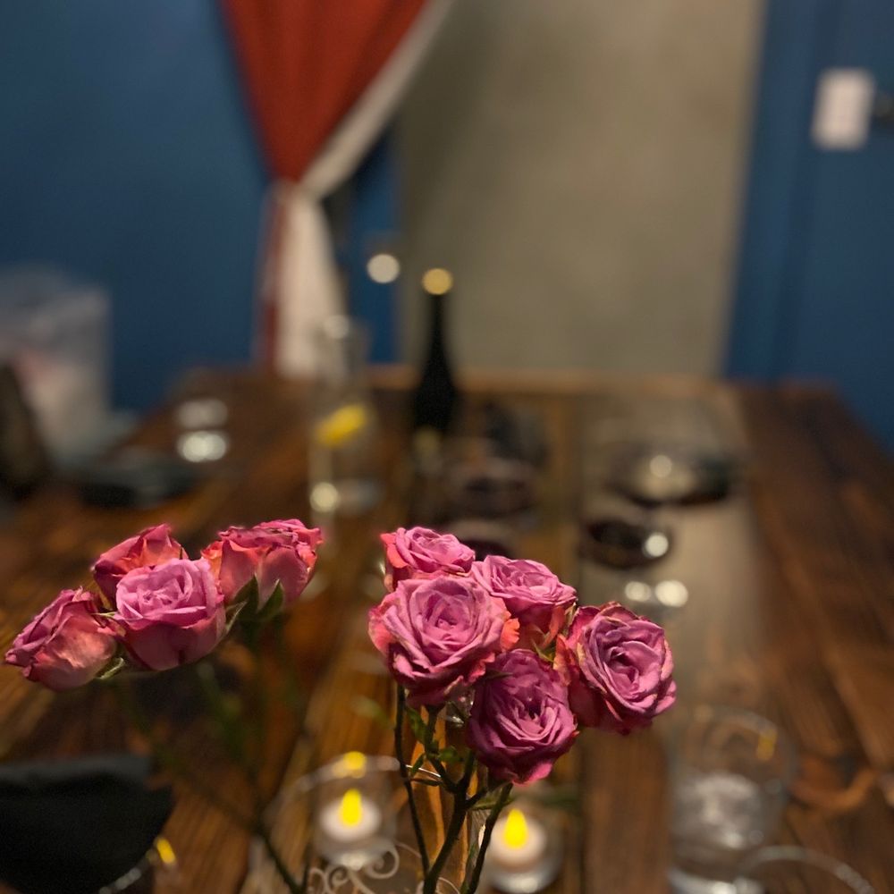 Firefly - pink roses in a glass vase on a wooden table - Cocktail Bars Near Me - Flushing, New York