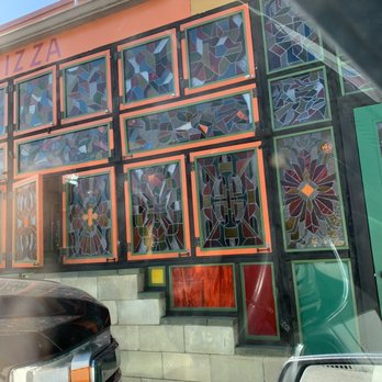 Satchel's Pizza - Outside decor by parking. - Pizza Near Me - Gainesville, Florida