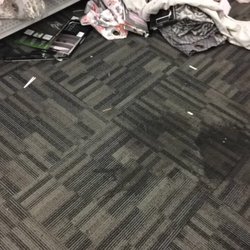 Huge stain and merchandise on the floor.