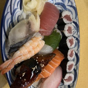 Mitama Restaurant - A variety of sushi and sashimi, including tuna, shrimp, salmon, eel, and rolls, arranged on a patterned plate with pickled ginger and wasabi. - Japanese Near Me - Berkeley, California