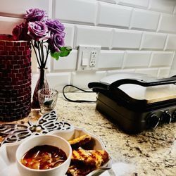 Grocery Outlet - Made grilled cheese with Sourdough bread shredded Parmesan cheese and tomato - carrot soup, all bought at Grocery Outlet for cheap.