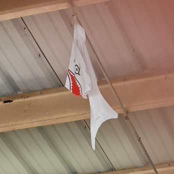 Sharky's Bar - a flag hanging from the ceiling - Bars Near Me - Vinita, Oklahoma Sharky's Bar - a flag hanging from the ceiling - Bars Near Me - Vinita, Oklahoma