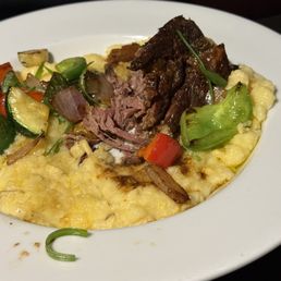 Braised rib on bed of polenta with roasted vegetables