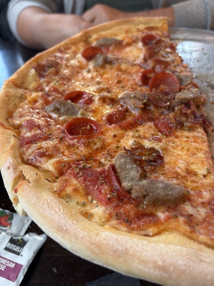 The Pizza Slice Logo