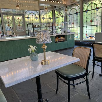 The Greenhouse - The interior is lined with stained glass! - Ice Cream & Frozen Yogurt Near Me - Kohler, Wisconsin The Greenhouse - The interior is lined with stained glass! - Ice Cream & Frozen Yogurt Near Me - Kohler, Wisconsin