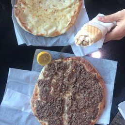 Cheese and meat manoosheh and chicken shawarma sandwich. Cheese manoosheh is on such thick bread. Cheese and meat manoosheh and chicken shawarma sandwich. Cheese manoosheh is on such thick bread.