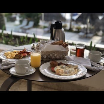 Shore Luv Travel - Breakfast on the first floor balcony - Travel Services Near Me