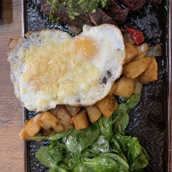 Ikaro - Steak (hanger) & eggs (cooked over easy and l added cheese) with side of spinach with house dressing. - Breakfast & Brunch Near Me - Middletown, New York