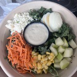 Saladworks - Build Your Own Bowl...Warm grain, kale, feta cheese crumbles, matchstick carrots, sweet corn, apples, egg & Greek vinaigrette dressing.