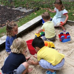 St Matthew's School - Playing in the sand box.