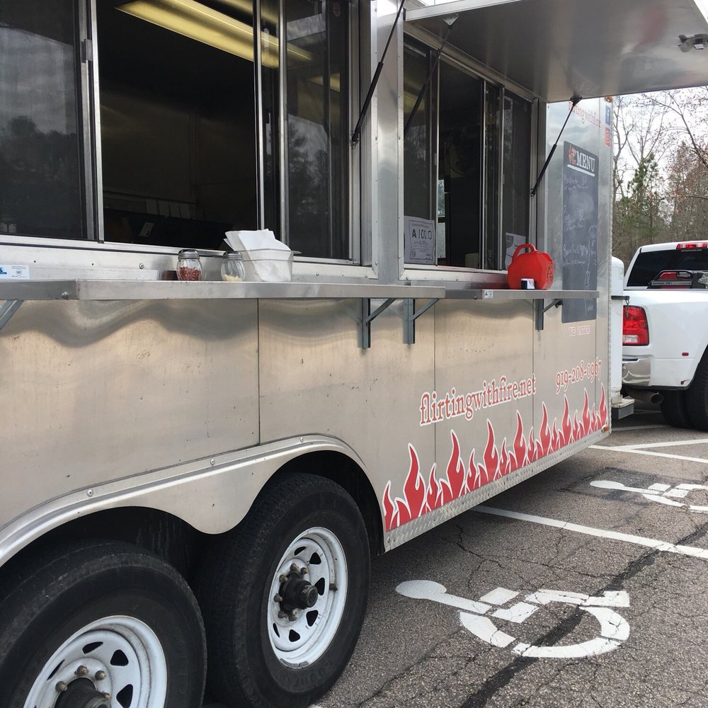 Flirting with Fire - a food truck parked in a parking lot - Food Trucks Near Me