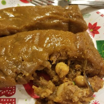 Adobo Latin Kitchen - Pasteles cut into. Garbanzo, pork, olives and just an amazing taste. Taste like the ones I make and grew up with. - Latin American Near Me - Easton, Pennsylvania