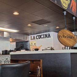 Petrini's San Diego - From where I was seated, this is looking back toward the kitchen where you see inscriptions such as "la cucina" and "Petrini's"