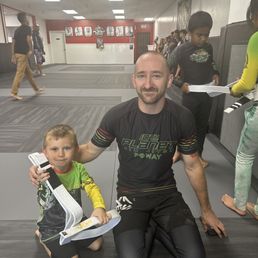 Jacob earning his first ever stripe in Jiu Jitsu from Coach Kyle.
