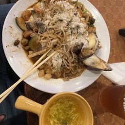 a plate of noodles with meat and vegetables a plate of noodles with meat and vegetables
