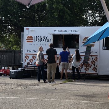 Jonny Poppers - a group of people standing in front of a food truck - Food Trucks Near Me Jonny Poppers - a group of people standing in front of a food truck - Food Trucks Near Me