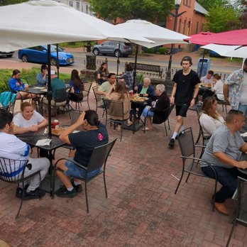 The Cubby Hole - a group of people sitting at tables under umbrellas - Breakfast & Brunch Near Me - Moorestown, New Jersey
