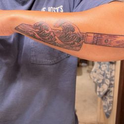 3 Tattoo - Knife tattoo with great wave.