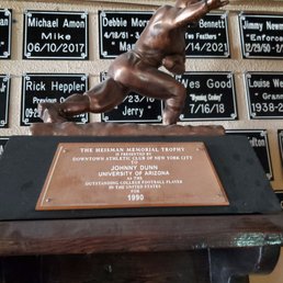 All those black plaques are to memorialize former regulars. And look at that...a real Heisman Trophy!