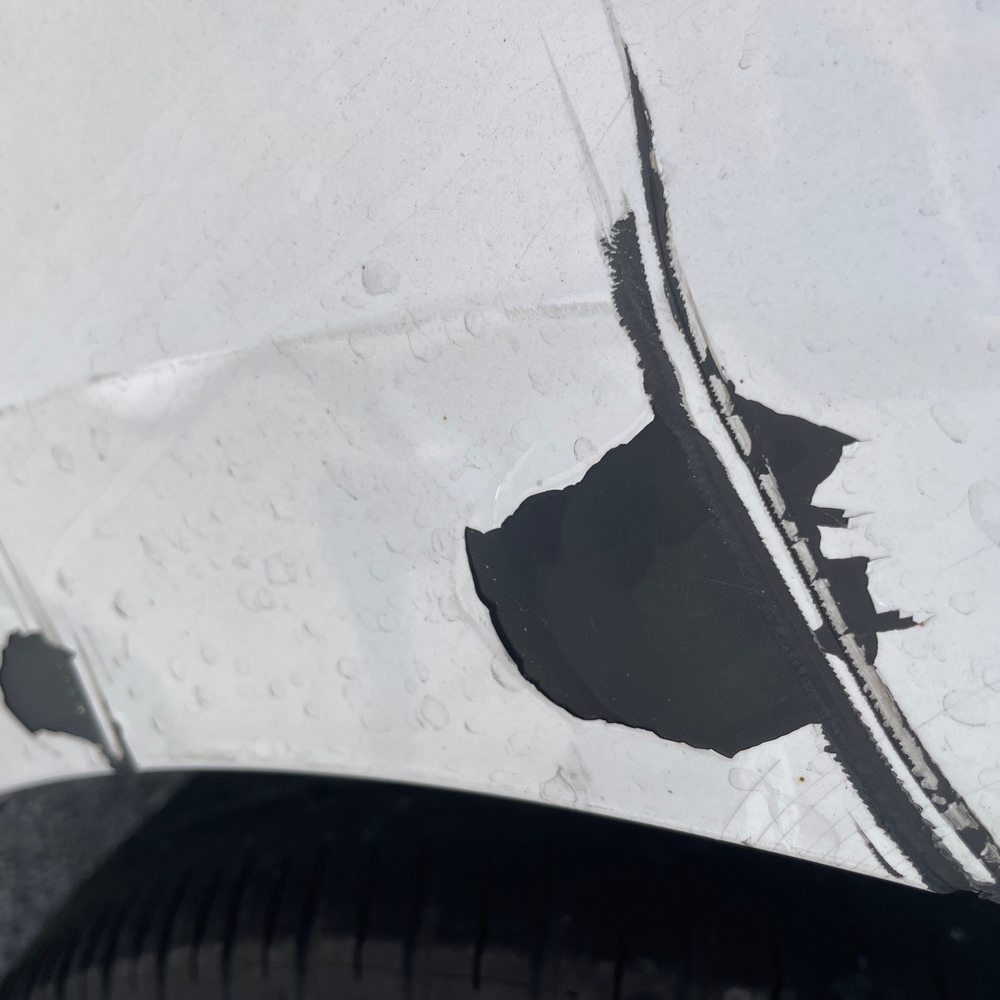 Precision Auto Body - You can see there is only paint on top of plastic here, no primer. - Auto Repair Near Me - Orlando, Florida