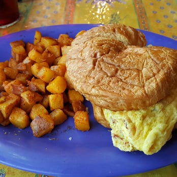 Over Easy Cafe - Egg Omelette Sandwich with Potatoes - Breakfast & Brunch Near Me - Sanibel, Florida Over Easy Cafe - Egg Omelette Sandwich with Potatoes - Breakfast & Brunch Near Me - Sanibel, Florida