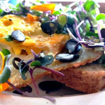 Ok & M - Avocado Toast with egg  and mixed greens served with fresh organic sprouts - Food Delivery Services Near Me - Boynton Beach, Florida