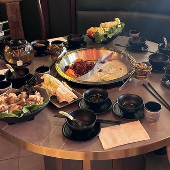 Xi Hotpot - Basic yin yang broth set up, but I would just get bone broth and add spiciness to the dipping sauce - Hot Pot Near Me - Duluth, Georgia
